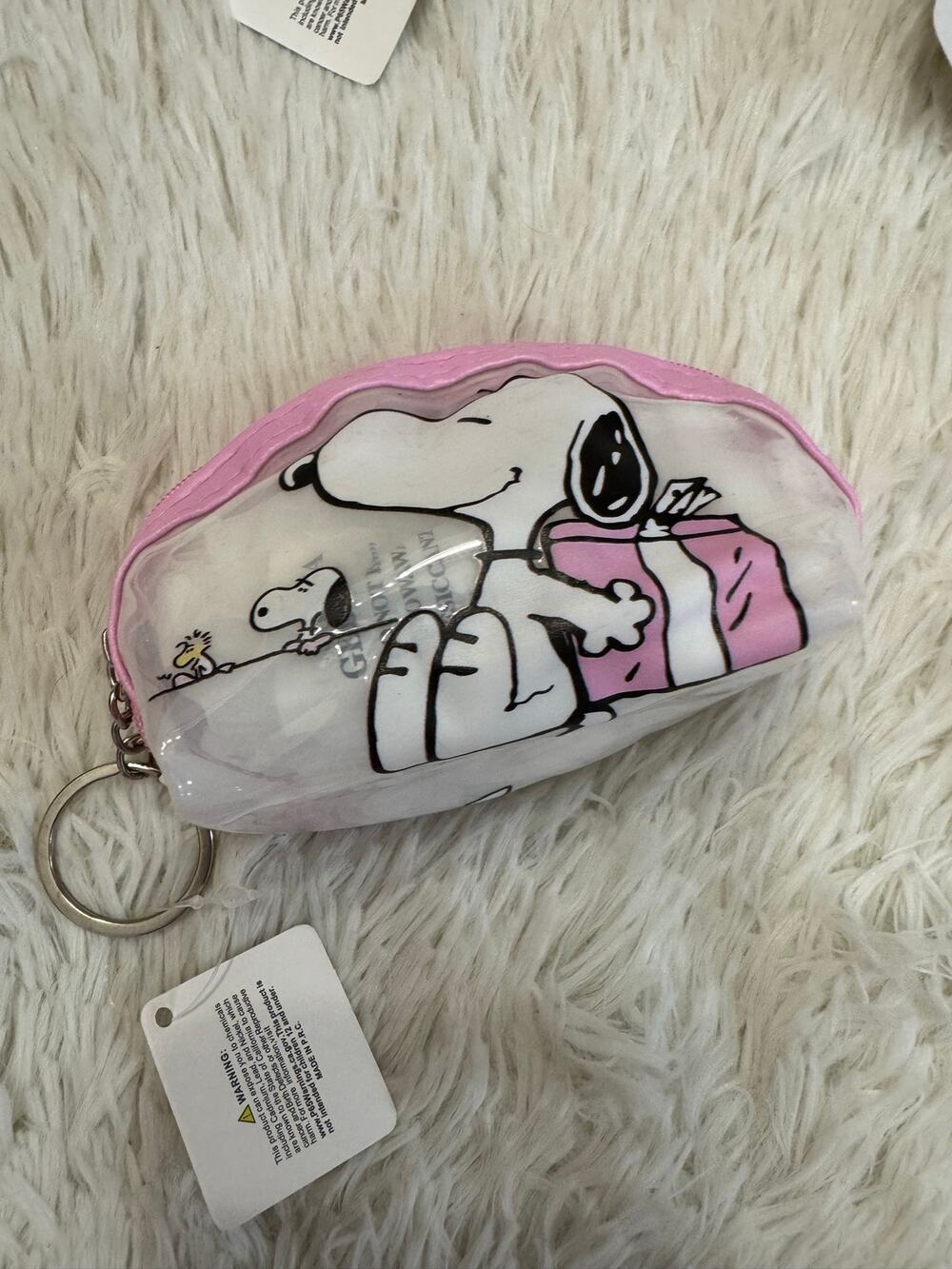 Snoopy and Woodstock hiding a pink gift in his back coin purse keychain zipper